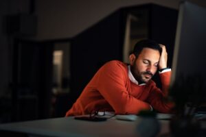 businessman-working-overtime-falling-asleep-at-th-2026-01-09-11-58-18-utc - Serenity Healthy Smiles