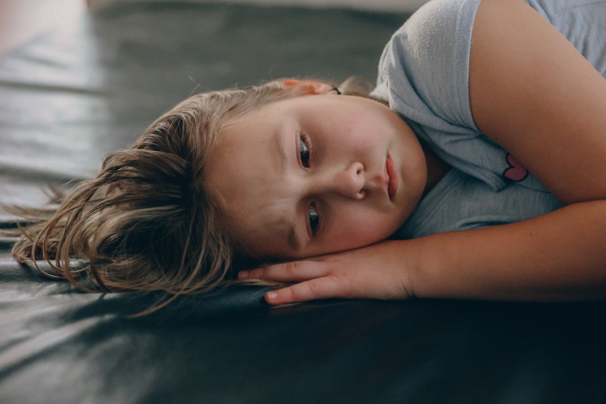 Child showing signs of tongue-tie, a common cause of mouth breathing in children